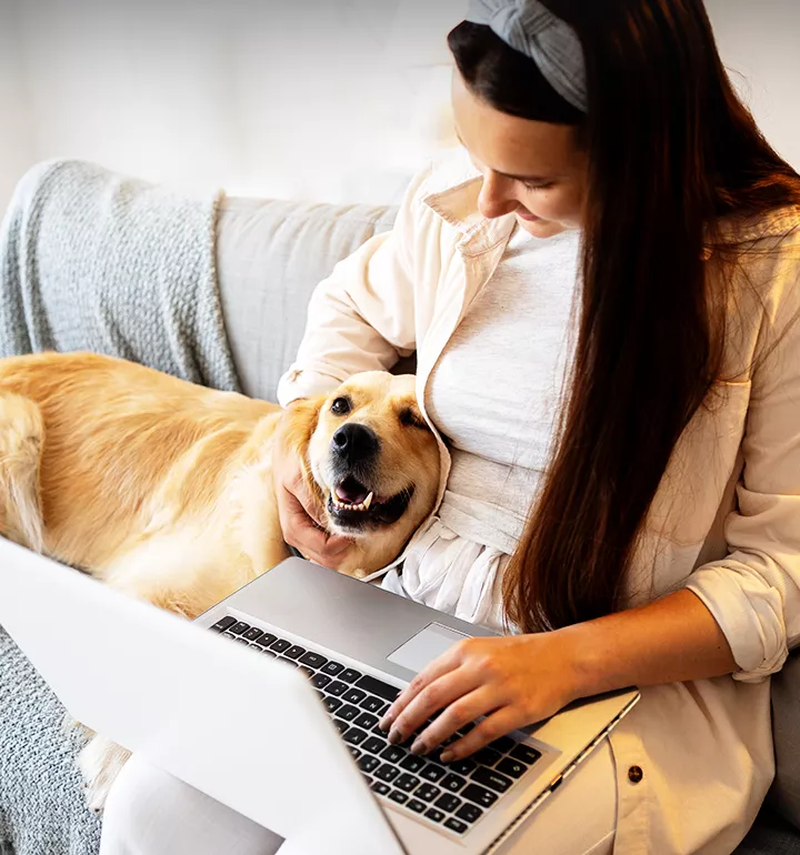 woman with cute dog and laptop